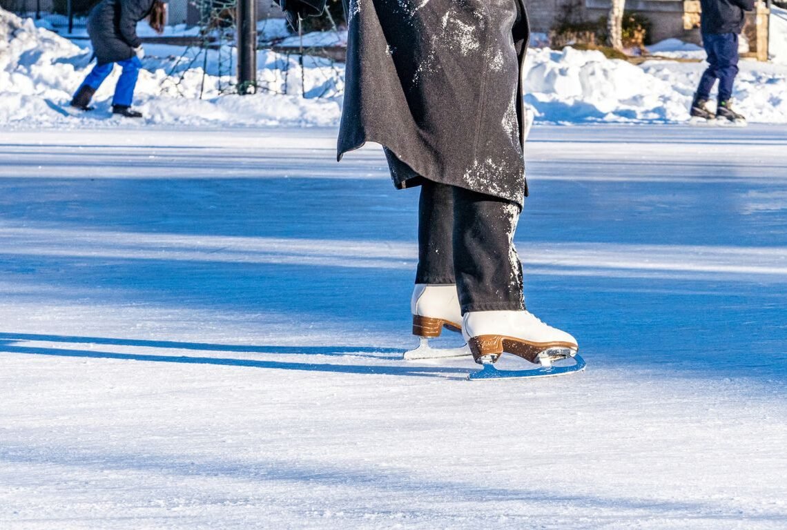 a person on a skateboard on a frozen lake